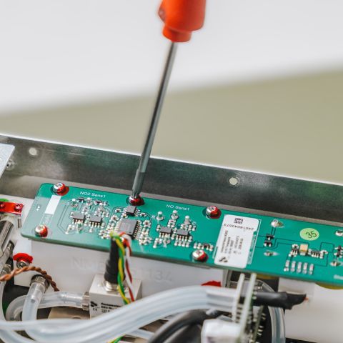 Screwdriver screwdriver in screw on circuit board